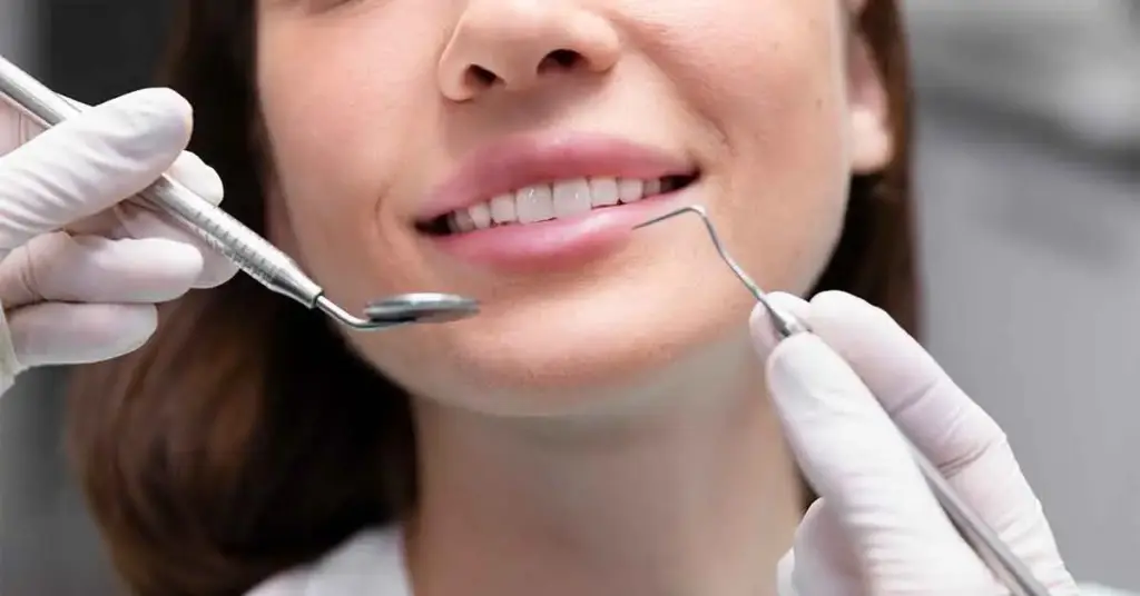 Patient experiencing tooth sensitivity during a dental consultation