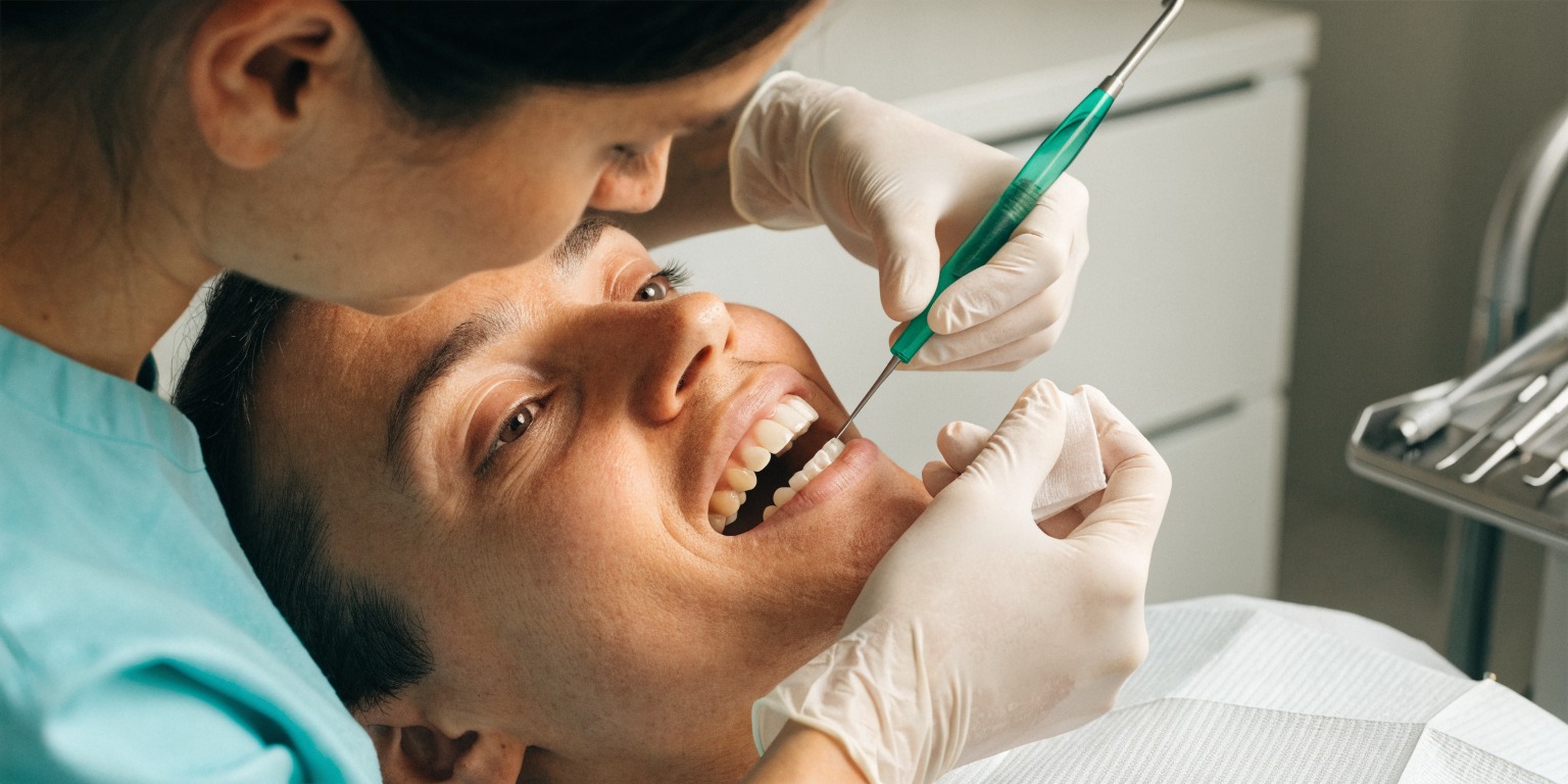 Adult patient receiving a routine professional implant maintenance visit