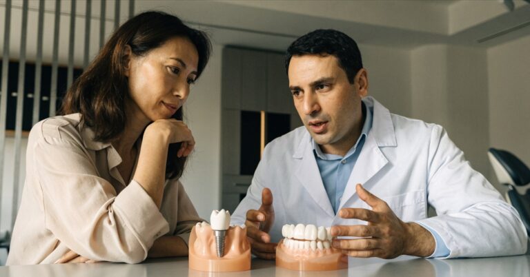 Patient reviewing dental implant and bridge options with a dentist