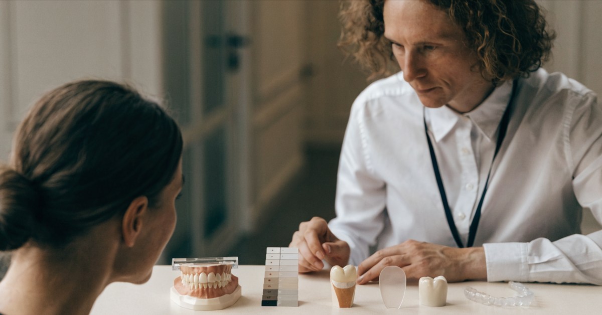 Dentist selecting individualized treatments for a Hollywood Smile rather than automatically choosing veneers