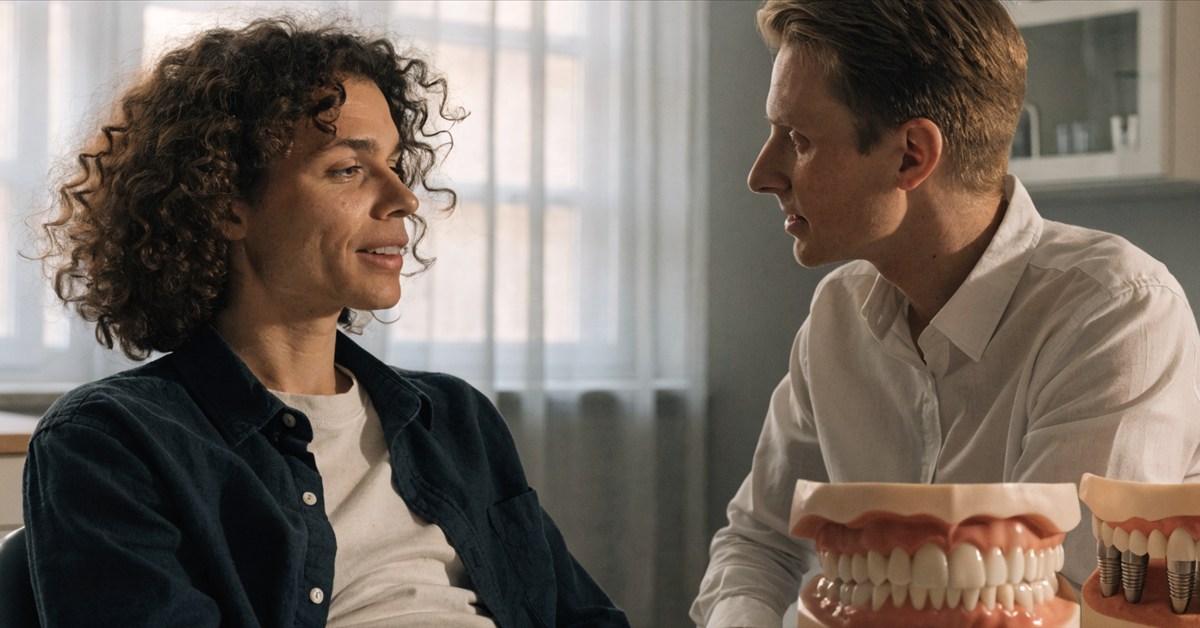 Adult dental patient discussing eating comfort and denture stability during a consultation