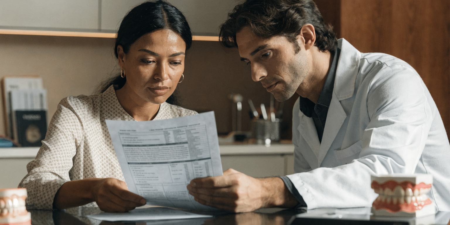 Patient reviewing treatment and travel questions before booking a Hollywood Smile trip