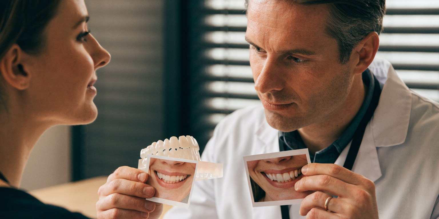 Dentist evaluating whether a limited number of treated teeth will blend naturally