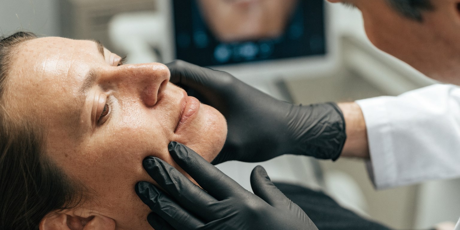 Dental patient attending a calm follow-up appointment after sinus lift surgery